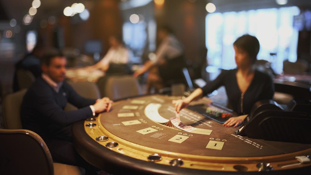 A cruise ship casino guest enjoying the tables games in the casino